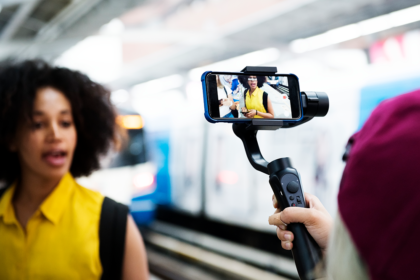 A brand specialists posing in front of a camera