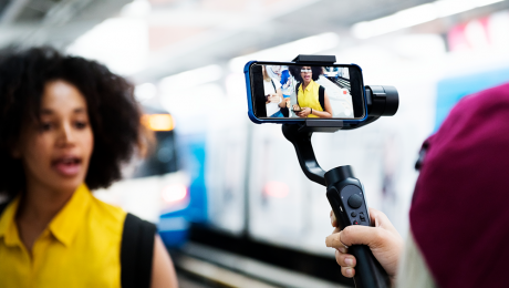 A brand specialists posing in front of a camera