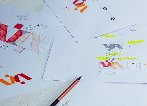 sketches-drawings-logo-printed-paper-development-logo-design-studio-table
